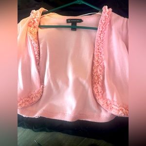 Woman’s pink ruffle short sleeve over cardigan . Lightly used .